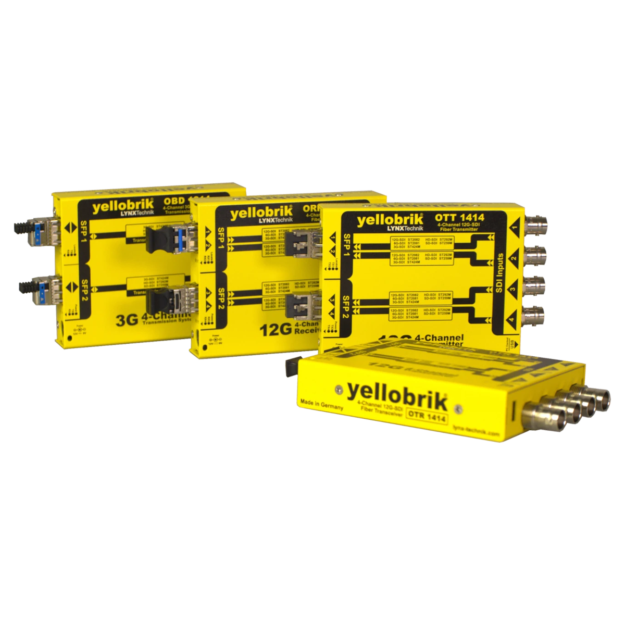 Yellow yelloBrik fiber optic modules arranged in a row, labeled 4-channel transmitter/receiver units for RF/optical transmission (OEM industrial gear).