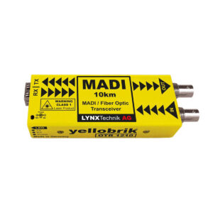 Yellow MADI fiber optic transceiver module with IN/OUT connectors on the right, labeled 'MADI 10km' and 'Lynx Technik AG'.